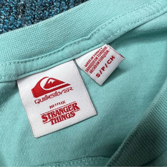 Quicksilver x Strangers Things Short Sleeve Graphic T-Shirt in Teal Blue Neon - Picture 5 of 6